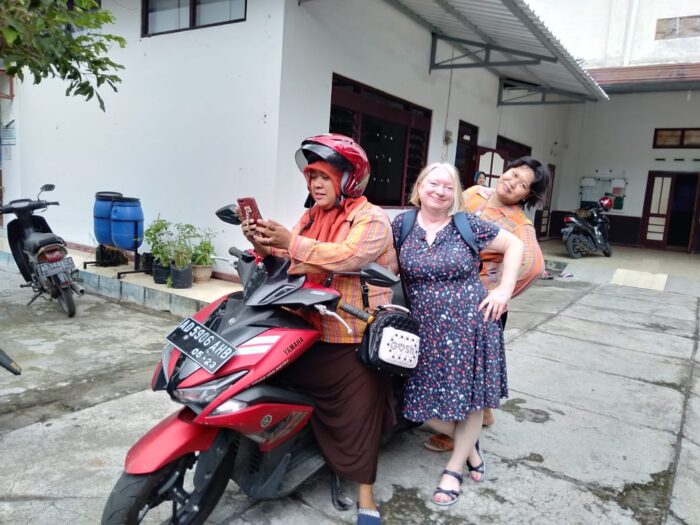 Three women on a motorbike in Surakarta